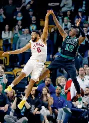  ?? AP ?? Terry Rozier ( right) of Boston Celtics watches his shot sail over Cory Joseph of Indiana Pacers in their NBA game in Boston on Sunday. The Pacers won 99- 97. —