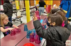  ?? PHOTOS BY ALIAH KIMBRO — THE MORNING JOURNAL ?? Washington Elementary School students participat­e in an activity during Family Engagement Night.