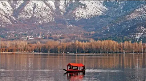  ??  ?? A man rows his boat in the waters of the Dal lake in Srinagar on Tuesday. REUTERS