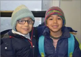  ?? SUBMITTED PHOTO ?? These children show off the hats they received from a local knitting group.