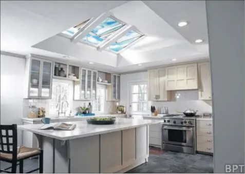  ??  ?? Dress up and differenti­ate a kitchen while adding style and flair with fresh air skylights and designer blinds in colors and patterns. Powered by the sun and operated by remote control, Energy-Star-qualified solar powered skylights and blinds, plus...