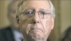  ??  ?? Senate Majority Leader Mitch McConnell of Ky. listens during a news conference July 27 on Capitol Hill in Washington. President Donald Trump raised the possibilit­y Thursday that McConnell should step down if he can't muscle health care and other...