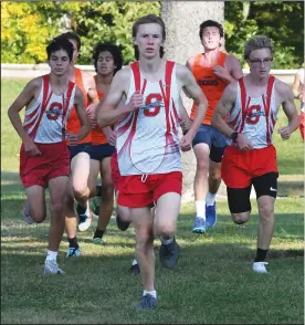  ?? CHUCK RIDENOUR/SDG Newspapers ?? Shelby’s boys cross country team put forth a dominating display during Tuesday’s run against Galion and Mansfield Madison at Amann’s Reservoir. Helping the SHS cause, from left, are Carson Perkins, Graeme Harvey and Nate Ganzhorn.