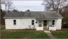  ?? SUBMITTED PHOTO ?? The owners of this modest local home were beneficiar­ies of generosity of volunteers who helped to fix a leaky roof.