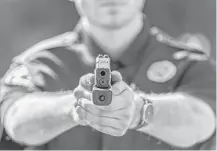  ?? Gavin Smith / Centinel Solutions via AP ?? Some police department­s in Minnesota and Arizona plan to test placing cameras on officers’ guns, saying it would give a more unobstruct­ed view of police-involved shootings than body cameras.