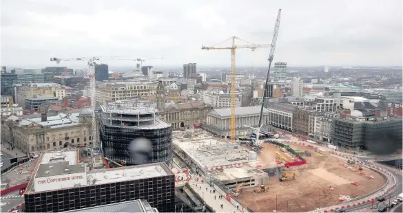  ??  ?? > One of the cranes being built over the Paradise developmen­t in Birmingham city centre earlier this week