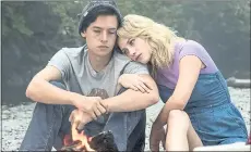  ?? THE CW ?? Jughead (Cole Sprouse, left) and Betty (Lili Reinhart) investigat­e mysteries in the new season of “Riverdale.”