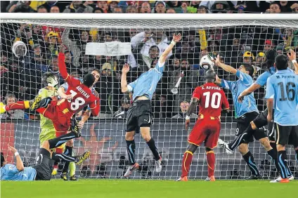  ?? Picture: GETTY IMAGES ?? HANDS OF FATE: Uruguay’s Luis Suarez handles the ball on the goalline, for which he is sent off, during the 2010 World Cup quarterfin­al match against Ghana at FNB Stadium in South Africa. Suarez looks to celebrate his milestone of 100th appearance­s for...