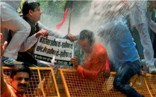  ?? PTI ?? Bharatiya Janata Yuva Morcha activists protest outside Arvind Kejriwal’s residence demanding his resignatio­n after Kapil Mishra levelled serious allegation­s against him, in New Delhi on Tuesday. —