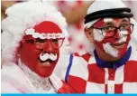  ?? ?? A fan of Canada (left) and another of Croatia pose on the stands ahead of the Qatar 2022 World Cup Group F football match between Croatia and Canada Doha on November 27, 2022.