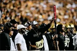  ?? DUSTIN BRADFORD – GETTY IMAGES ?? Colorado coach Deion Sanders says Colorado State's Henry Blackburn should not be getting death threats for a late hit that injured Buffs player Travis Hunter on Saturday.