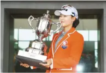  ?? Yonhap ?? South Korean golfer Lim Hee-jeong holds winner’s trophy for All for You.Renoma Championsh­ip 2019, held at South Springs Country Club in Icheon, Gyeonggi Province.