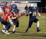  ?? AUSTIN HERTZOG - DIGITAL FIRST MEDIA ?? Spring-Ford’s Selwyn Simpson tries to evade a pair of Central Bucks East defenders on a carry last Friday.