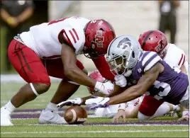  ?? Charlie Riedel The Associated Press ?? Kansas State defensive back D.J. Render recovers an on-side kick against Arkansas State. The Red Wolves’ special teams players have been hit especially hard by COVID-19.