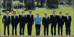  ?? Picture: REUTERS ?? ROSE: German Chancellor Angela Merkel welcomes world leaders, from left: Donald Tusk (European Union), Shinzo Abe (Japan), Stephen Harper (Canada), Barack Obama (US), Francois Hollande (France), David Cameron (UK), Matteo Renzi (Italy), and Jean-Claude...