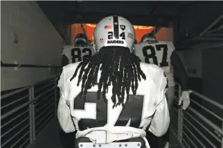  ?? Christian Petersen / Getty Images ?? The Raiders’ Marshawn Lynch prepares to take the field at University of Phoenix Stadium in Arizona on Saturday. Lynch sat for the national anthem before the exhibition opener.