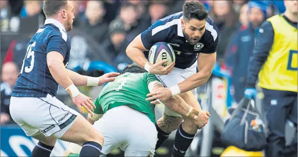  ??  ?? COMING THROUGH: Sean Maitland rides the challenge of Ireland’s Sean O’Brien on Saturday