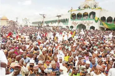  ??  ?? Crowd in front of the Emir of Ilorin palace during the 2019 grand durbar celebratio­n