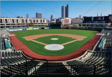  ?? PHOTO BY MIKE MOORE/THE JOURNAL-GAZETTE ?? In this April 8, 2020, file photo, an empty Parkview Field minor league baseball stadium is shown in downtown Fort Wayne, Ind. Unlike the NFL, NBA or Major League Baseball that can run on television revenue, it’s impossible for some minor sports leagues in North America to go on in empty stadiums and arenas in light of the coronaviru­s pandemic.