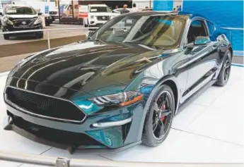  ?? Gene J. Puskar, The Associated Press ?? A 2019 Ford Mustang Bullitt was on display at the Pittsburgh Auto Show. The latest Bullitt version of the model pays homage to the chase car from the 1968 Steve Mcqueen movie of the same name.