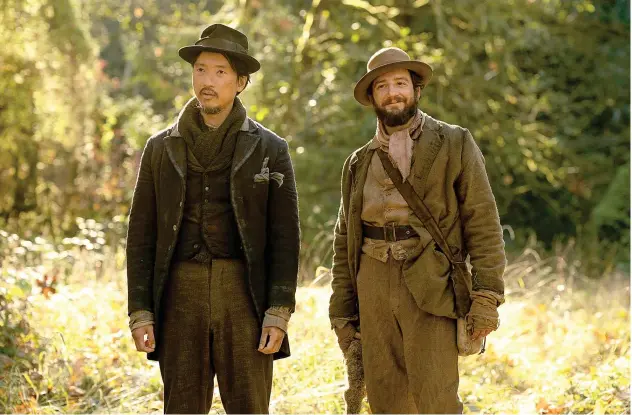  ??  ?? Top: Orion Lee (left) and John Magaro in the film ‘First Cow’.