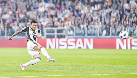  ?? EPA ?? Juventus’ Dani Alves scores his team’s second goal against Monaco at the Juventus Stadium in Turin.