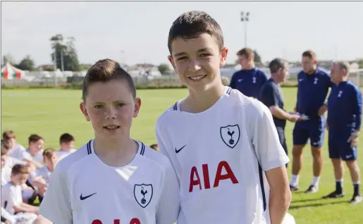  ??  ?? Sean Goff and Luke McQuillan at the Drogheda Boys Player Developmen­t course with Tottenham Hotspur coaches.