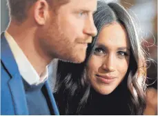  ?? FOTO: DPA ?? Prinz Harry und Meghan Markle stehen im Fokus der Fotografen.