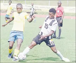  ?? (File pic) ?? Denver Sundowns’ Mthokozisi Hlatjwako (L) fights for the ball with Mbabane Highlander­s’ Sisekelo ‘Rio’ Matsenjwa.