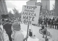  ?? REUTERS ?? A protester holding a placard against Donald Trump at the Republican National Convention, Cleveland, United States, July 21