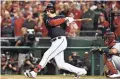  ??  ?? Nationals first baseman Ryan Zimmerman hits a single against the Cardinals in Game 4 of the NLCS on Oct. 15 in Washington.