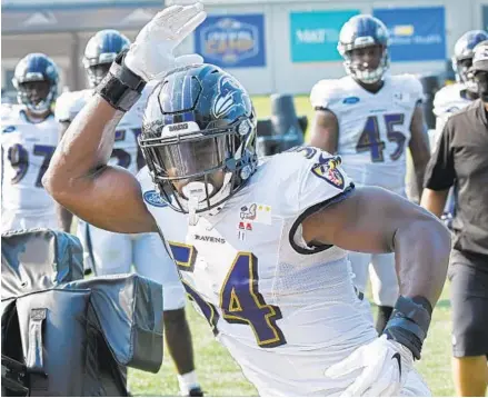  ?? KENNETH K. LAM/BALTIMORE SUN ?? Ravens outside linebacker Tyus Bowser works out at the Under Armour Performanc­e Center during training camp on Tuesday.