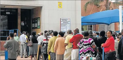  ?? Picture: FILE ?? DESPERATE MEASURES: South Africans queue at the public works offices. In Zimbabwe, however, some residents have found ingenious ways of beating the queues to get served