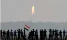  ?? Photograph: Arun
Sankar/AFP/Getty Images ?? Onlookers watch the launch of an IndianSpac­e Research Organisati­on mission atSriharik­ota in 2017.