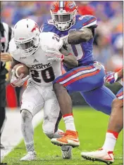  ?? ROB FOLDY / GETTY IMAGES 2015 ?? ESPN draft analyst Mel Kiper Jr. currently projects the Dolphins to select Gators linebacker Jarrad Davis (right) in the first round.