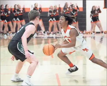  ?? ♦ Scott Herpst ?? LaFayette’s Jaylon Rasmey looks to take North Hall’s Clark Howell off the dribble during the Ramblers’ Class AAA state playoff opener last Wednesday. LaFayette won the game, 71-40, and followed up with a 63-54 victory over Greater Atlanta Christian on Saturday.