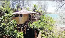  ?? BEN NEWTON/FOR THE WASHINGTON POST ?? The tree houses at Mandala Island Resort have mosquito netting.