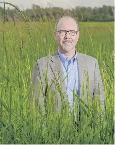  ??  ?? Kent Mullinix of Kwantlen University says too much designated agricultur­al land is being used for non-farm purposes such as housing.