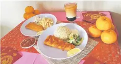  ??  ?? SugarBun’s Fortune Fish Meal which features its iconic fish fillet and special sauce. Customers have a choice of rice and pickles or fries and coleslaw to go with the fish fillet and special sauce.