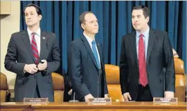  ?? Drew Angerer Getty Images ?? “WE MAY have some things we disagree on; we’ll try to get through those,” committee Chairman Devin Nunes, right, said of Rep. Adam Schiff, center.