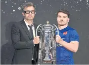  ?? AFP ?? France coach Fabien Galthie, left, and captain Antoine Dupont pose with the Six Nations trophy.
