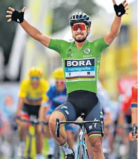  ??  ?? Leading the way: Peter Sagan crosses the finish line to win the fifth stage