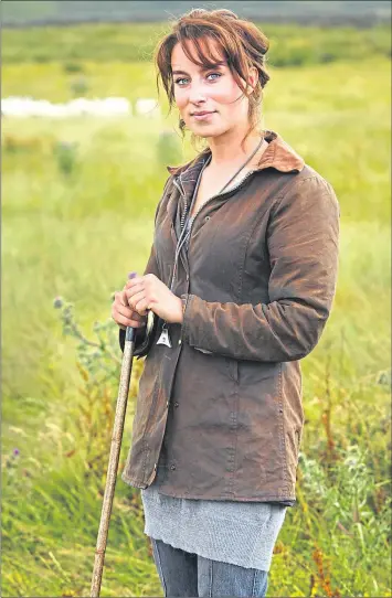  ?? Picture ?? Shepherd Emma Gray with her sheep
National Trust Images/ Arnhel de Serra