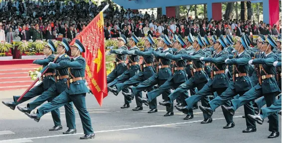  ?? Na Son Nguyen/ The As ociated Press ?? Members of the Vietnamese air force parade in Ho Chi Minh City on Thursday celebratin­g the 40th anniversar­y of the end of the Vietnam War.