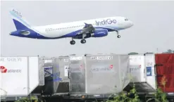  ??  ?? NEW DELHI: An aircraft of Indian airline IndiGo lands at Indira Gandhi Internatio­nal Airport in New Delhi. Shares in India’s largest carrier IndiGo soared almost 18 percent above their listing price on the airline’s trading debut yesterday as investors...
