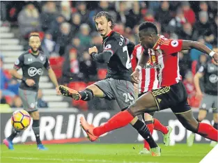  ??  ?? Manolo Gabbiadini drives home one of his two goals for Southampto­n.