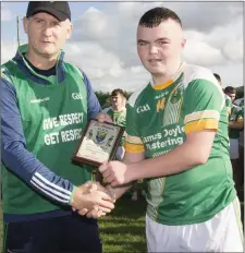  ??  ?? Robert Murtagh receives his Wicklow People Man of the Match award.