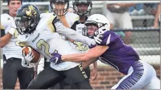  ?? Steven Eckhoff / Rome News-Tribune ?? Rockmart’s Markus Smith (2) tries to escape the grasp of Darlington’s Ezra Barnette during a preseason scrimmage Friday at Chris Hunter Stadium.