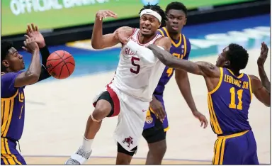  ?? (AP/Mark Humphrey) ?? Moses Moody (5) of Arkansas has the ball stripped as he drives against LSU’s Josh LeBlanc (11) in the second half of the SEC Tournament semifinal game Saturday in Nashville, Tenn. Moody finished with 28 points and nine rebounds for the Razorbacks, who lost 78-71. More photos at arkansason­line.com/314uasec/