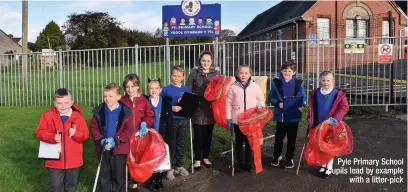  ??  ?? Pyle Primary School pupils lead by example with a litter-pick